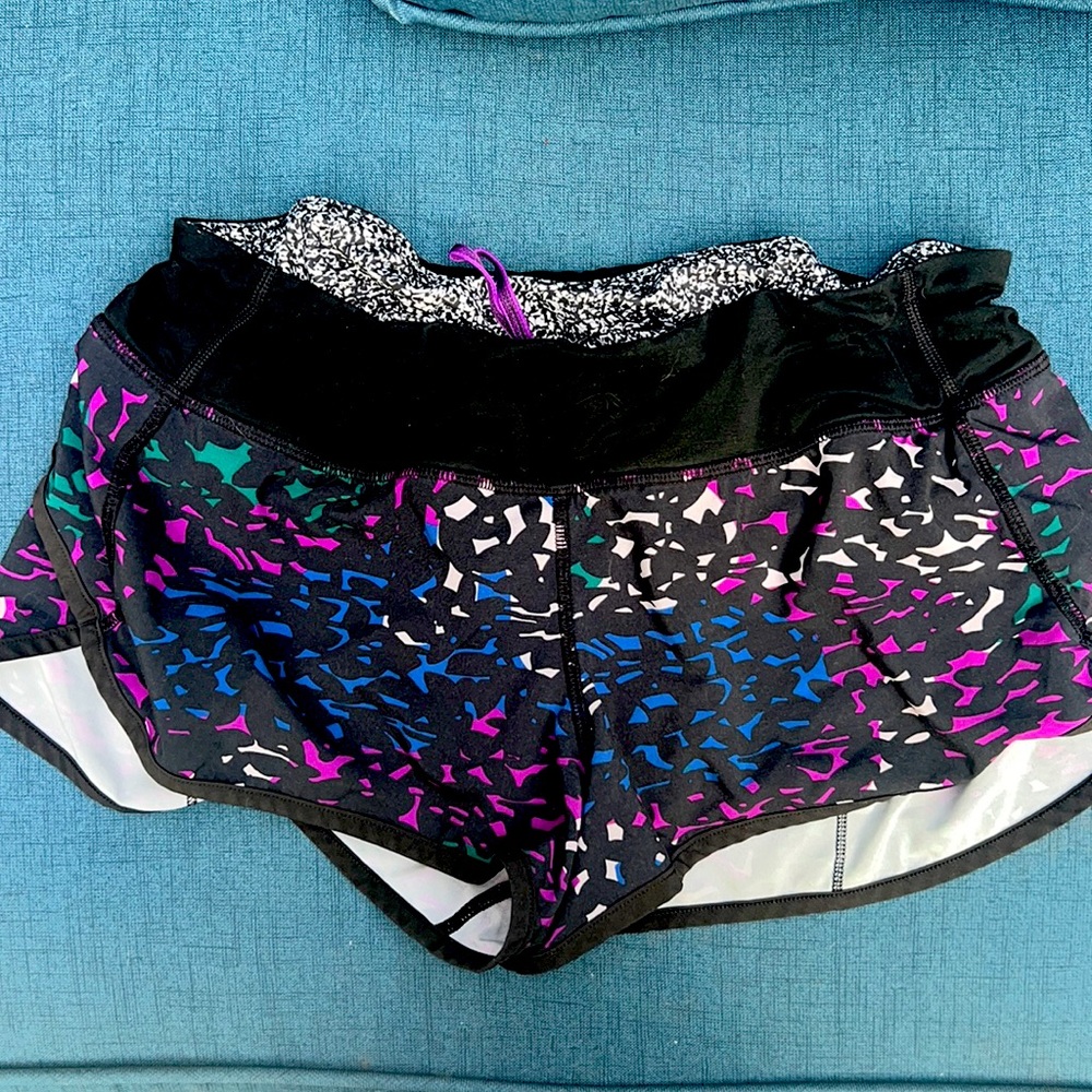 Lululemon Speed Short. 2.5 inseam. Black, blue, purple, green design.